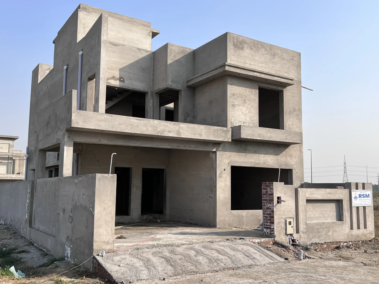 A grey structure home from the supplied construction brochure